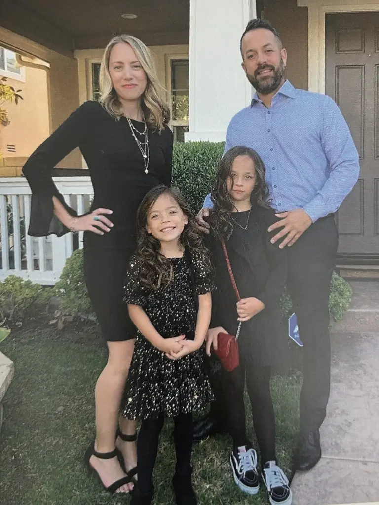 Brian Trejo with his wife and two daughters